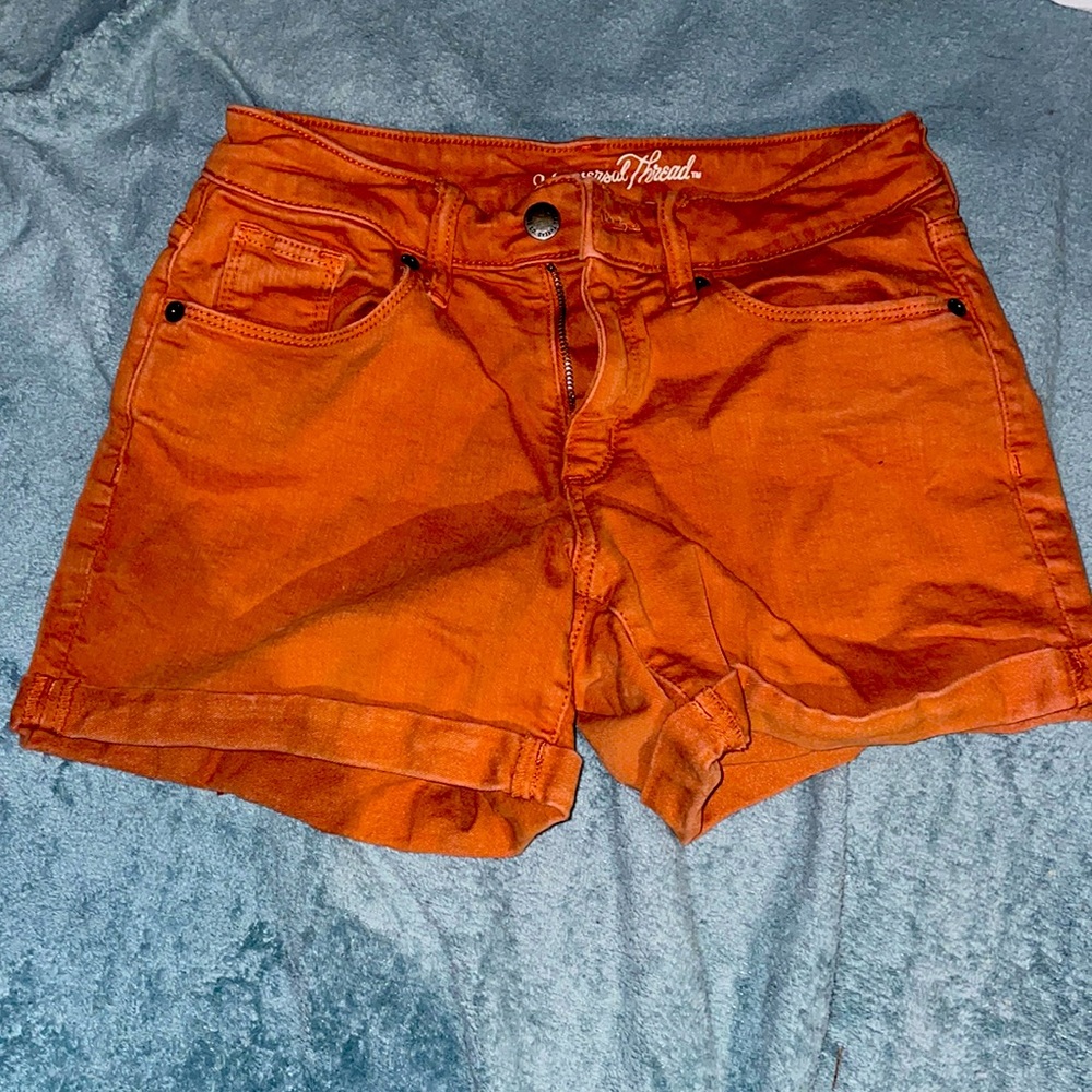 Orange jean shorts, mid waist